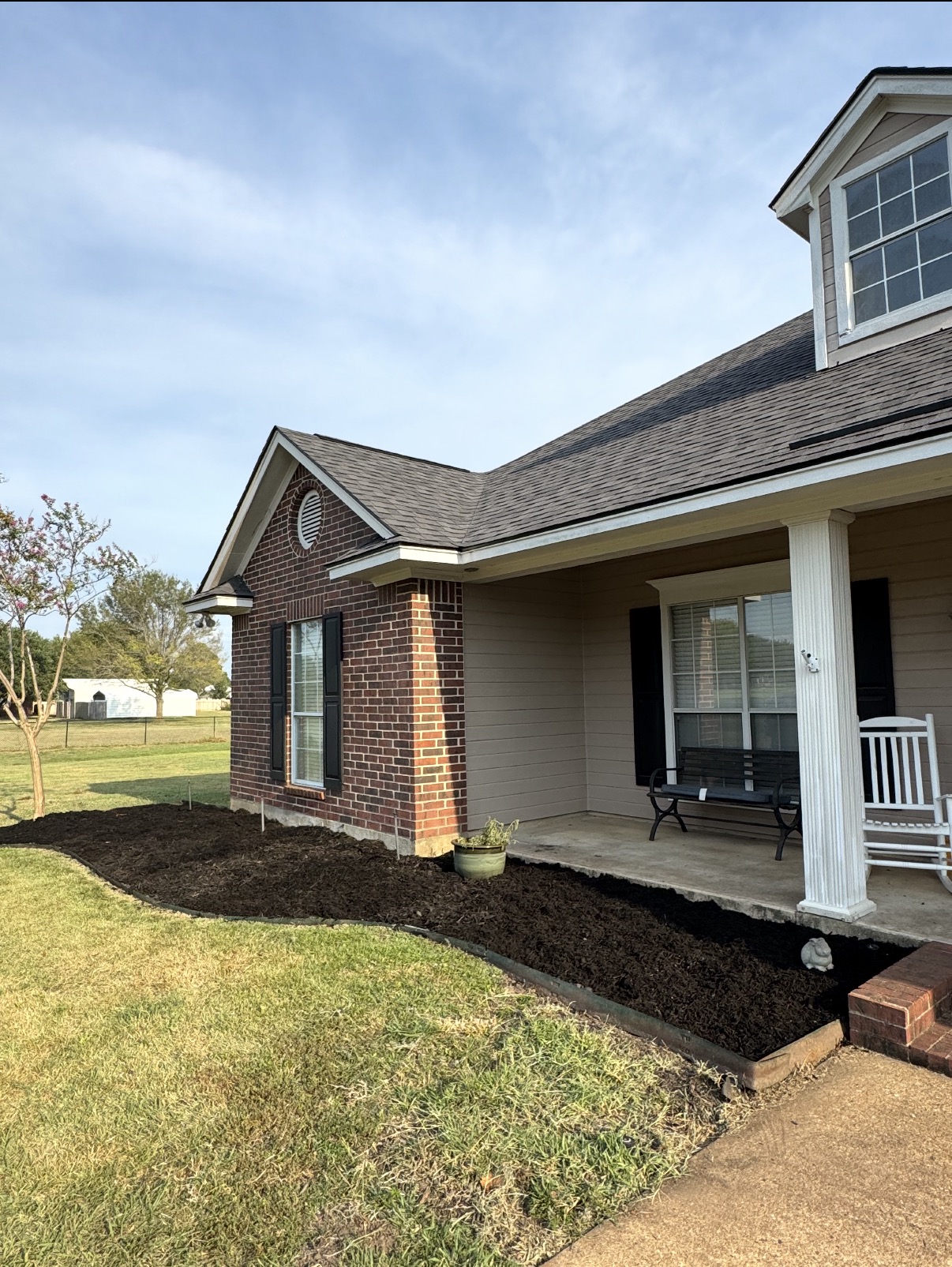 Foundation bed cleanup & fresh mulch — after