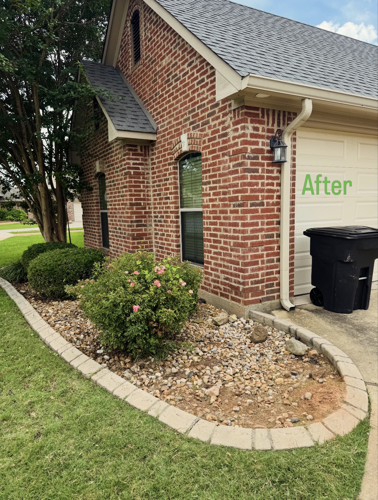 Corner bed makeover with decorative rock — after